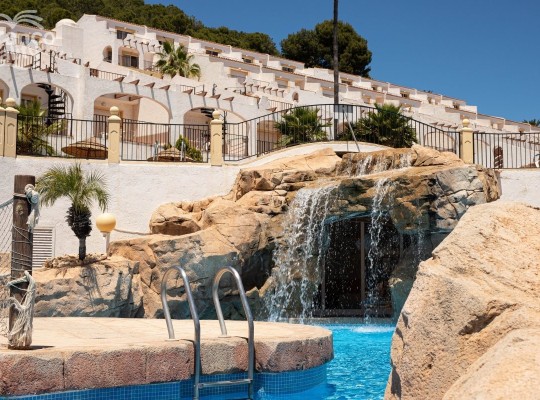 Urbanization of bungalows with spectacular views of the Mediterranean Sea and Peñón de Ifach in Calpe.